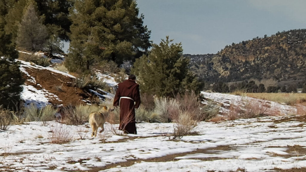 Saint Francis walking with the Wolf of Gubbio