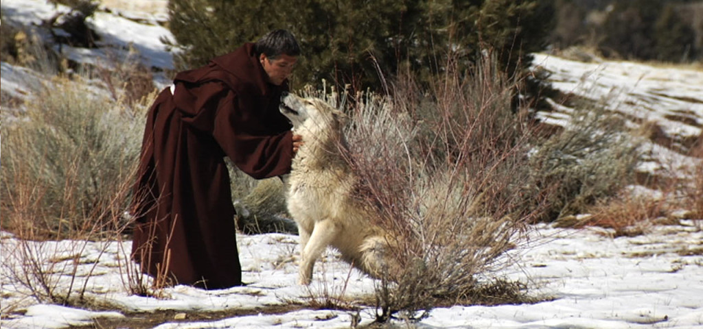 Franciscan Friar Petting the Wolf